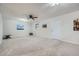 Bright living room with neutral paint, carpet, a ceiling fan, and access to the outside at 6118 Dana Ct, Lithonia, GA 30058