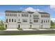 Charming townhome with gray brick, black shutters, and a one-car garage at 6137 Wayburn St, Tucker, GA 30084