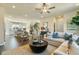 Open concept living area with a kitchen island, staircase, and a comfortable seating arrangement at 6137 Wayburn St, Tucker, GA 30084