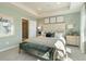 Comfortable main bedroom with tray ceilings, a decorative headboard, and bright natural light at 6137 Wayburn St, Tucker, GA 30084