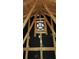 An attic fan is centered in the wooden support structure of the attic, with dark lining in the background at 872 Misty View Ct, Lilburn, GA 30047