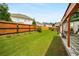 Beautifully landscaped backyard, featuring a lush green lawn, a patio area, and a newly installed privacy fence at 872 Misty View Ct, Lilburn, GA 30047