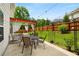 Enjoy an outdoor patio with comfortable seating, great for relaxing with views of the green backyard at 872 Misty View Ct, Lilburn, GA 30047