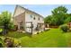 Enjoy outdoor living on this large lot featuring a green lawn, a privacy fence, and a covered patio at 872 Misty View Ct, Lilburn, GA 30047