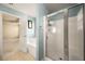 Stylish bathroom with a separate shower and tub combo; blue walls and white trim at 872 Misty View Ct, Lilburn, GA 30047