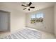 Cozy bedroom with carpet, a ceiling fan, natural light, and view to neighborhood street at 872 Misty View Ct, Lilburn, GA 30047