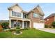 Inviting two-story brick home with a manicured lawn and vibrant blue shutters at 872 Misty View Ct, Lilburn, GA 30047