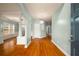 Elegant foyer showcasing hardwood floors and arched entryways, filled with natural light at 872 Misty View Ct, Lilburn, GA 30047