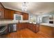 Well-designed kitchen with stainless steel appliances and hardwood floors connecting to the living room at 872 Misty View Ct, Lilburn, GA 30047