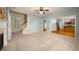 Spacious living room with fireplace and an open floor plan to the kitchen at 872 Misty View Ct, Lilburn, GA 30047