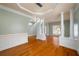 Bright living room with hardwood floors, decorative columns, and stylish ceiling lights at 872 Misty View Ct, Lilburn, GA 30047