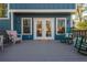 Inviting back deck with seating and double doors leading into the home at 1555 Steele Nw Dr, Atlanta, GA 30309