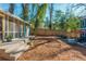 Relaxing backyard with a charming deck, wooden fence, and mature trees offering shade at 1555 Steele Nw Dr, Atlanta, GA 30309