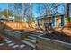 Beautiful backyard featuring a screened-in porch and manicured landscaping at 1555 Steele Nw Dr, Atlanta, GA 30309