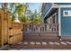 Backyard deck featuring a wooden gate and fenced yard with greenery at 1555 Steele Nw Dr, Atlanta, GA 30309