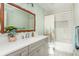 Fresh bathroom design with a wide mirror, a tiled shower and a neutral color palette at 1555 Steele Nw Dr, Atlanta, GA 30309