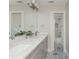 Bathroom featuring a double sink vanity with white counters and cabinets, as well as decorative tile flooring at 1555 Steele Nw Dr, Atlanta, GA 30309