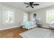 Charming bedroom with hardwood flooring, large windows, and a comfortable, stylish decor at 1555 Steele Nw Dr, Atlanta, GA 30309