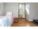 Well-lit bedroom with hardwood floors and a cozy workspace area near a bright window at 1555 Steele Nw Dr, Atlanta, GA 30309