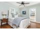 Serene bedroom featuring a comfortable bed, hardwood floors and plenty of natural light at 1555 Steele Nw Dr, Atlanta, GA 30309