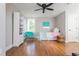Bright bedroom with hardwood flooring, built-in shelving, and comfortable decor at 1555 Steele Nw Dr, Atlanta, GA 30309