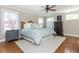 Comfortable bedroom featuring hardwood floors, a ceiling fan and classic furnishings at 1555 Steele Nw Dr, Atlanta, GA 30309