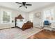 Cozy bedroom featuring a wooden bed frame, bedside tables, windows and ceiling fan at 1555 Steele Nw Dr, Atlanta, GA 30309