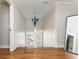 Bright hallway with chandelier and hardwood floors, providing an inviting transition between rooms at 1555 Steele Nw Dr, Atlanta, GA 30309