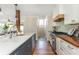 Spacious kitchen featuring a large island, stainless steel appliances, and hardwood floors at 1555 Steele Nw Dr, Atlanta, GA 30309