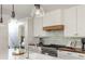 Beautiful kitchen featuring white cabinets, stainless steel appliances, and stylish backsplash at 1555 Steele Nw Dr, Atlanta, GA 30309