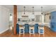 Kitchen featuring a blue island with white countertops, and stainless steel appliances at 1555 Steele Nw Dr, Atlanta, GA 30309