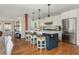 Open-concept kitchen featuring a blue island with seating and modern appliances at 1555 Steele Nw Dr, Atlanta, GA 30309