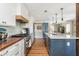 Modern kitchen with white cabinets, wood countertops, stainless steel appliances, and a large island at 1555 Steele Nw Dr, Atlanta, GA 30309