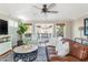 Inviting living room with a ceiling fan, a leather sofa and a large round table at 1555 Steele Nw Dr, Atlanta, GA 30309