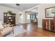 Open-concept living room with hardwood floors, and an adjacent dining area at 1555 Steele Nw Dr, Atlanta, GA 30309