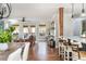 Open-concept living room with hardwood floors, a wooden support beam, and plenty of natural light at 1555 Steele Nw Dr, Atlanta, GA 30309