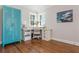 Bright office space with hardwood floors, white desk, and ample storage at 1555 Steele Nw Dr, Atlanta, GA 30309