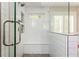 Modern tiled shower featuring a built-in bench and glass enclosure, offering a spa-like experience at 1555 Steele Nw Dr, Atlanta, GA 30309