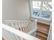 Staircase with natural light, featuring white railings and hardwood steps, creating a welcoming entrance at 1555 Steele Nw Dr, Atlanta, GA 30309