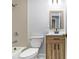 Bathroom with tub-shower, wood vanity, and good lighting at 3000 Fern Valley Sw Dr, Marietta, GA 30008