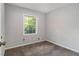 Neutrally painted bedroom featuring carpet flooring and a bright window view at 3000 Fern Valley Sw Dr, Marietta, GA 30008