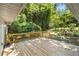 Outdoor deck with wooden railing overlooking lush greenery at 3000 Fern Valley Sw Dr, Marietta, GA 30008