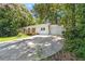 A house with white siding, a front porch, and a long concrete driveway at 3000 Fern Valley Sw Dr, Marietta, GA 30008