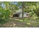 Home exterior with backyard and mature trees at 3000 Fern Valley Sw Dr, Marietta, GA 30008