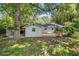 Rear exterior view of home with deck, backyard, and mature trees at 3000 Fern Valley Sw Dr, Marietta, GA 30008