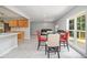 Open-concept area showcasing wood-look floors, a dining set, and seamless flow into the living room at 3000 Fern Valley Sw Dr, Marietta, GA 30008