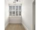 Cozy bright room with plantation shutters on the windows and neutral carpet at 3786 Turnberry Ct, Duluth, GA 30096