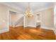 Open dining room with hardwood floors and a chandelier at 3786 Turnberry Ct, Duluth, GA 30096