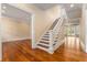 Elegant foyer with hardwood floors and a staircase leading to the upper level at 3786 Turnberry Ct, Duluth, GA 30096