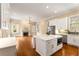 Modern kitchen with stainless steel appliances, quartz countertops and central island at 3786 Turnberry Ct, Duluth, GA 30096